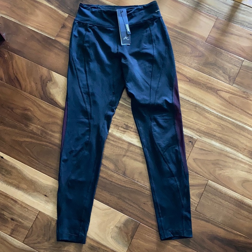 NWT Rion Leggings - size Medium - black w/back zipper pocket and peekaboo color